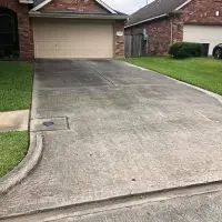 Dirty driveway before cleaning